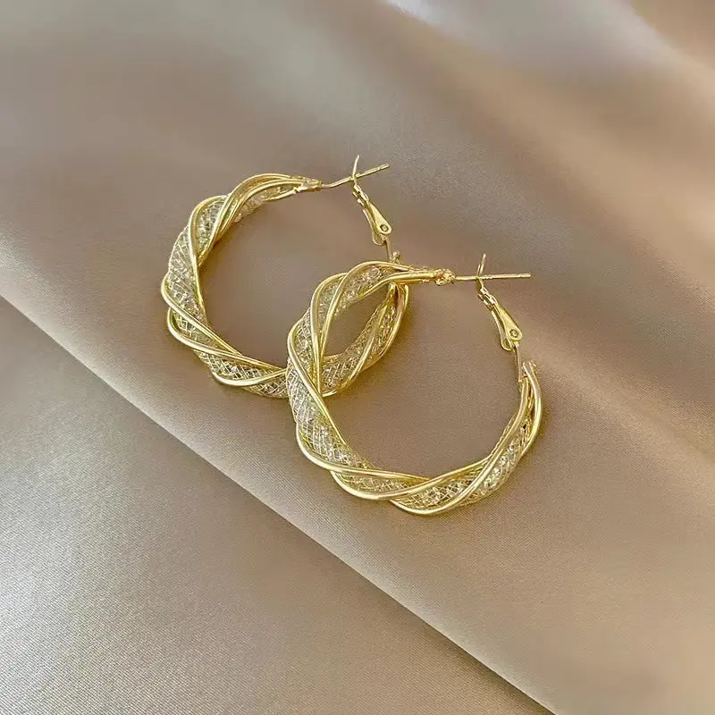 Small design winding metal earrings - Gold